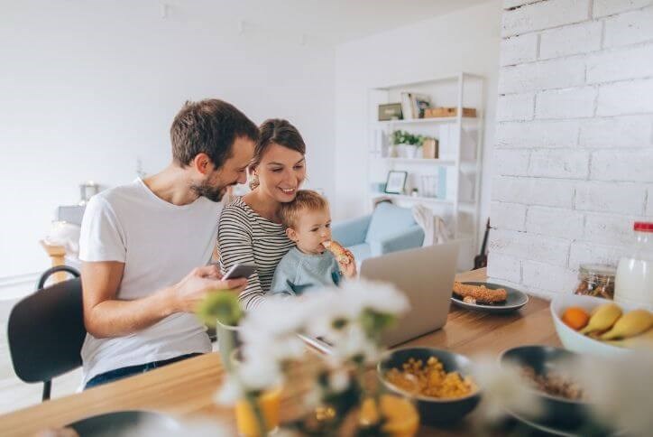 Happy millennial family at their new home | The Grove Frisco, a new home community in TX