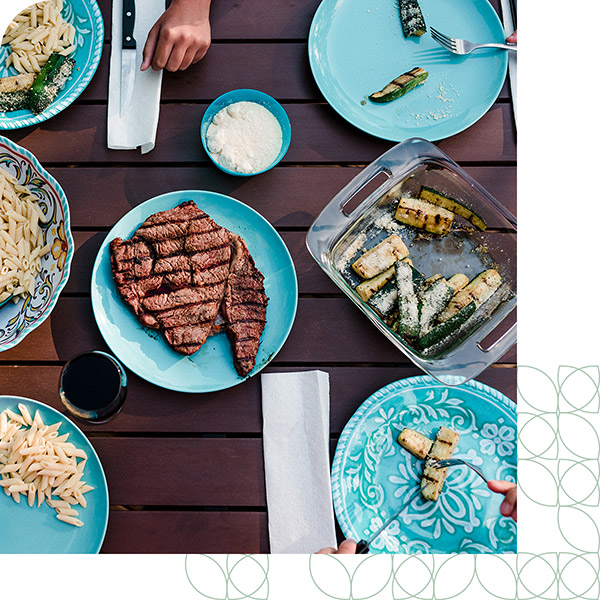 Residents grilling at the amenity center in The Grove Frisco community