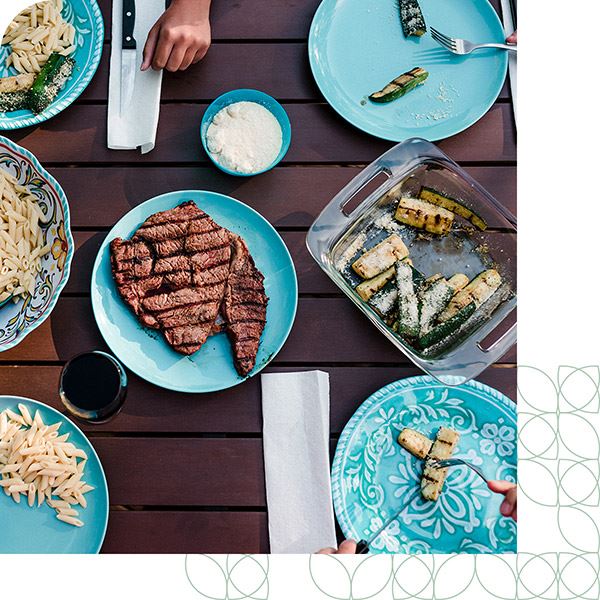 Residents grilling at the amenity center in The Grove Frisco community