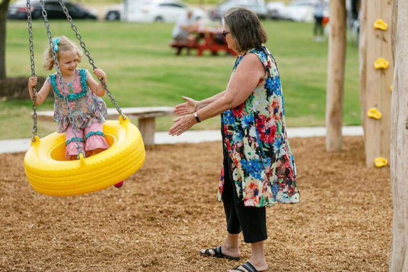 Resident enjoying park at The Grove Frisco community, Frisco TX
