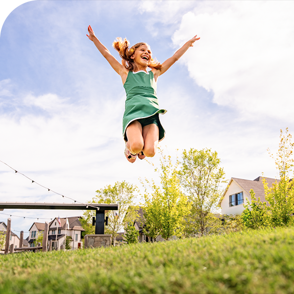 Girl Jumping In Park
