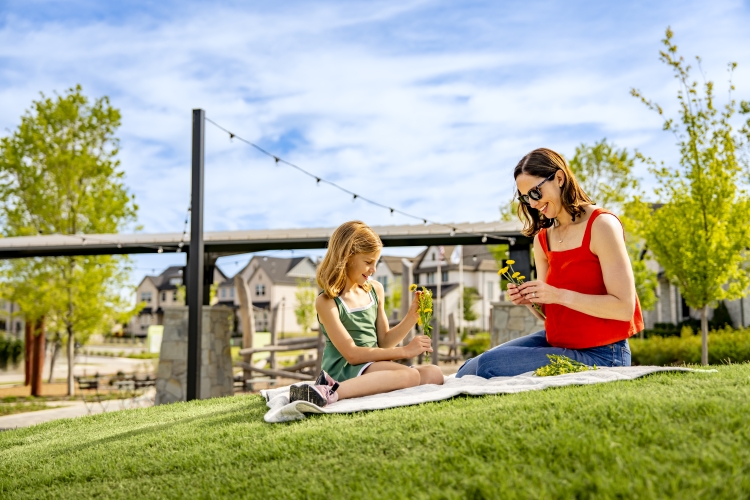 residents-enjoying-the-park-on-a-blanket-at-the-grove-frisco-texas.jpg