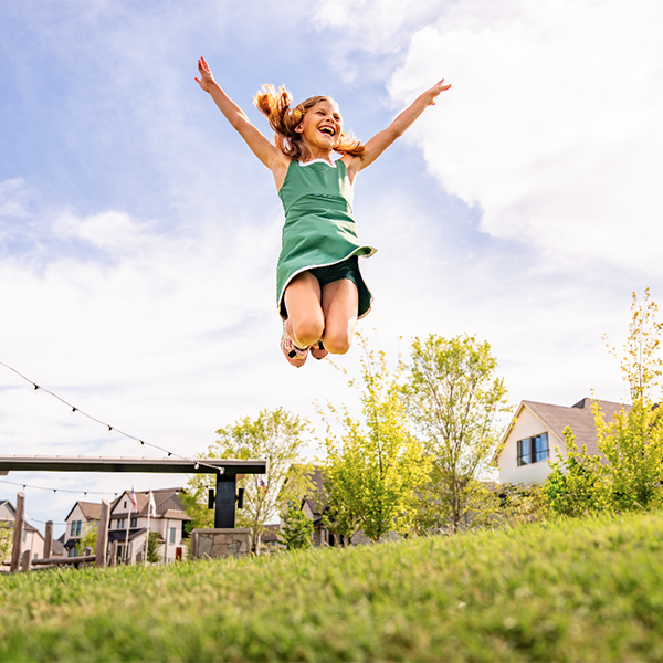 Girl Jumping In Park